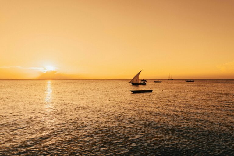 Sailboat silhouetted against a Zanzibar sunset